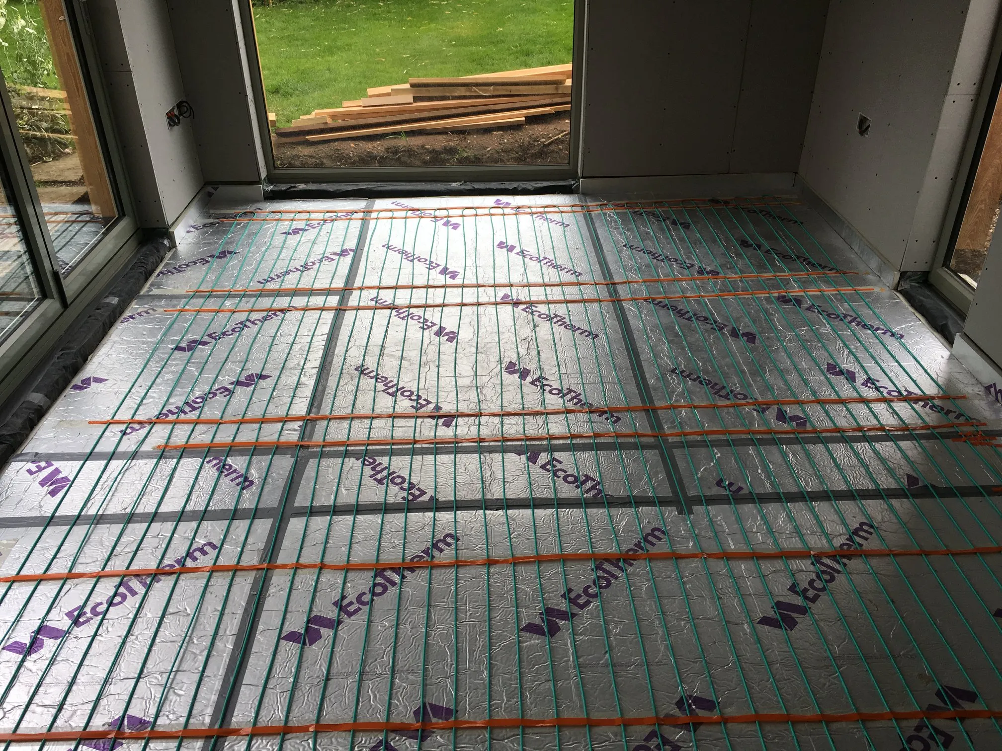 a room with a floor covered in insulation
