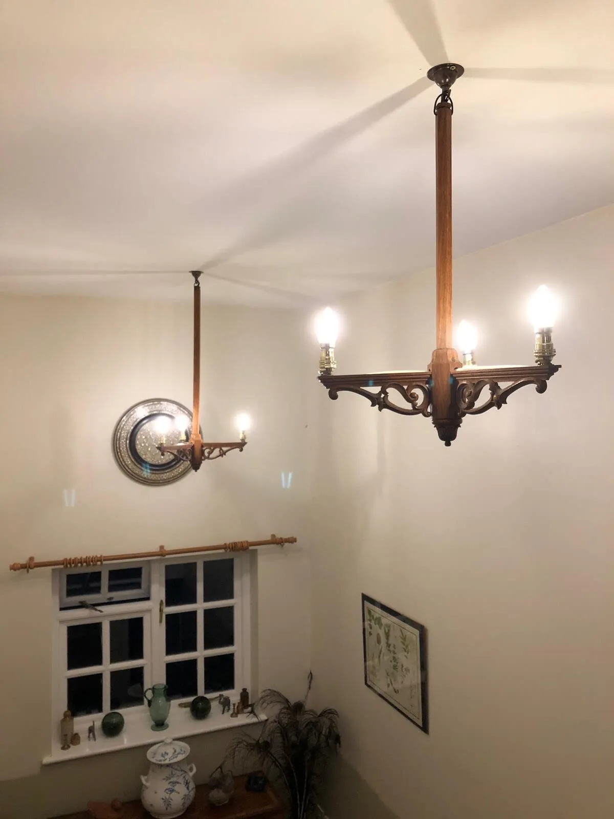 a chandelier hanging from a ceiling in a room